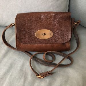 Brown leather handbag with brass hardware